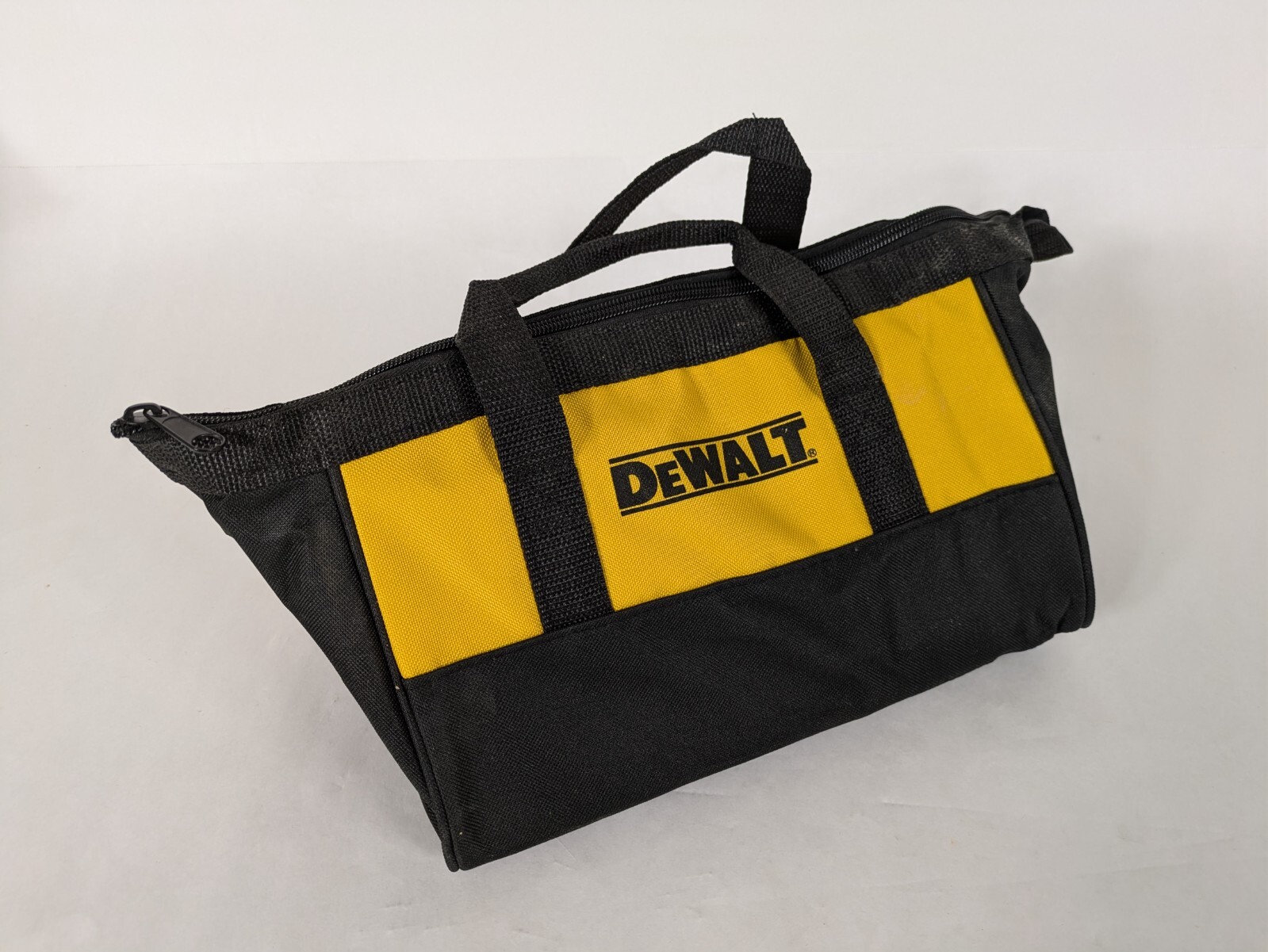 Small DeWalt Branded Tool Bag/ 11x9x7 inches tall/ triangular profile/ zipper