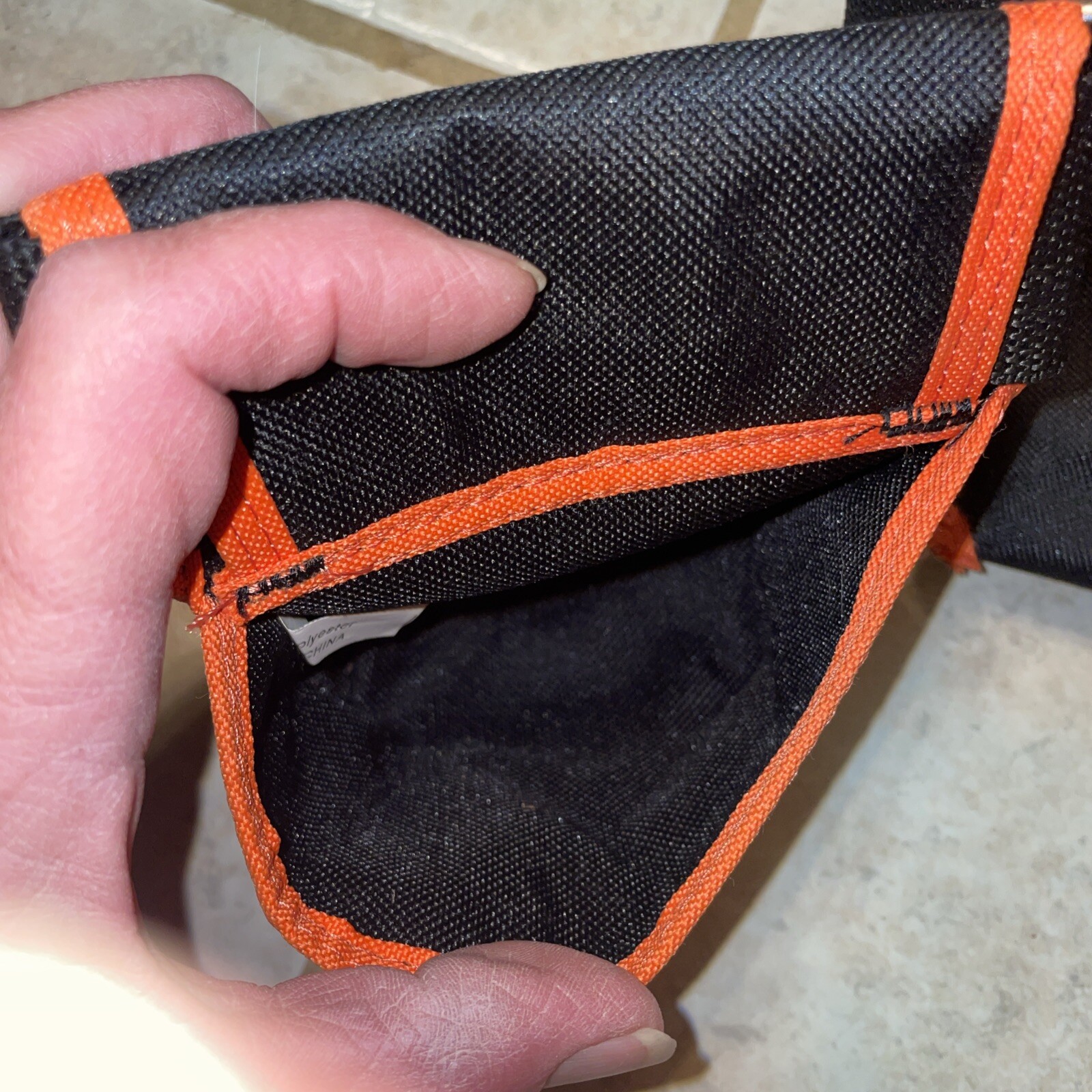 Black and orange removable tool belt with Tape Measure Pocket