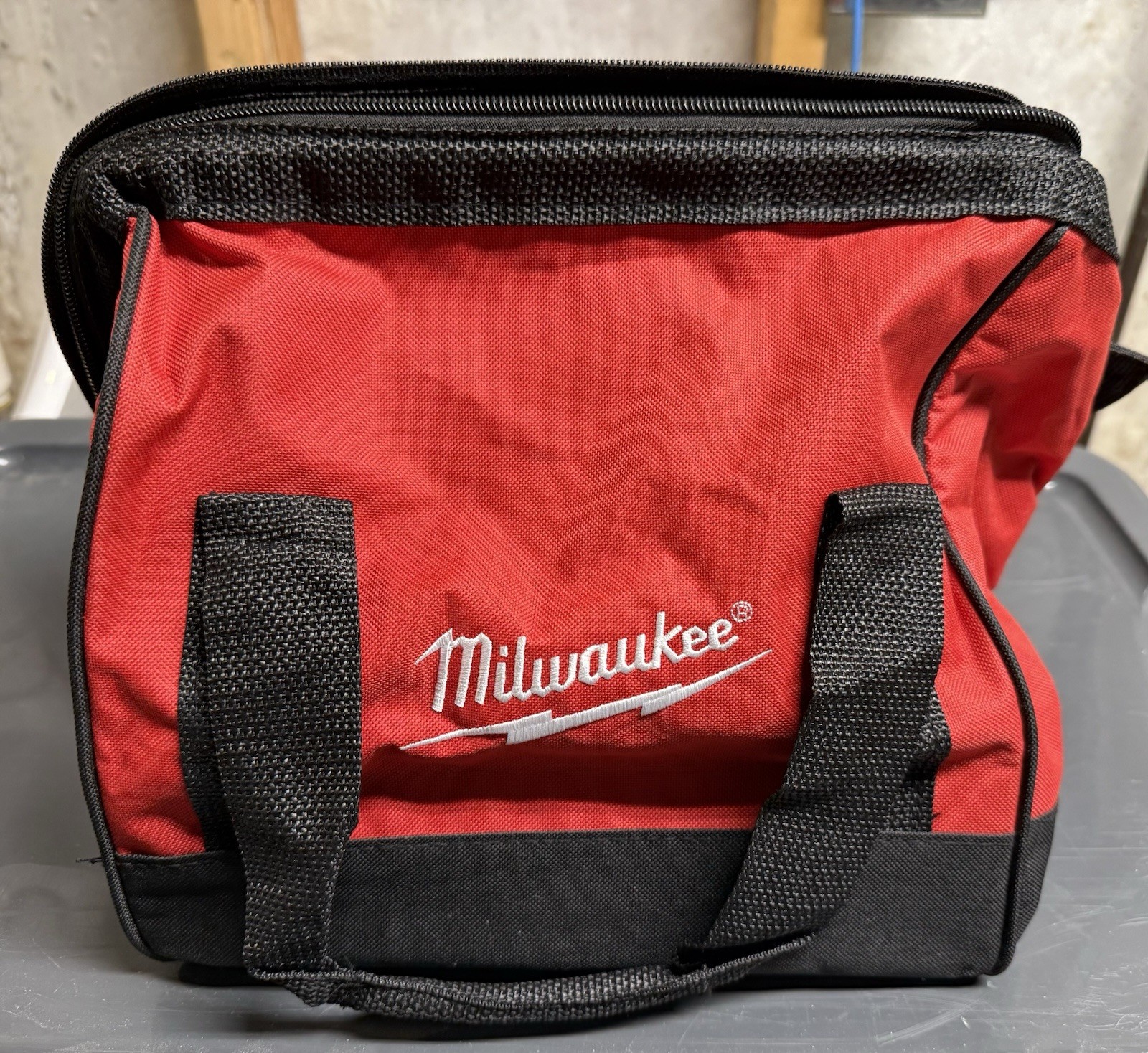 Milwaukee Red and Black Fabric Tool Bag with Handle and Zipper Closure